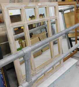 A sectional framed wall mirror.