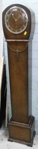An oak cased granddaughter clock.