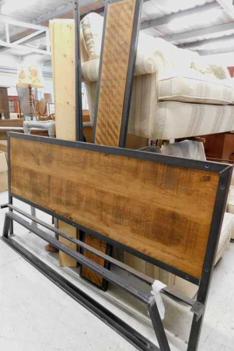 A modern super king size bed, with metal frame and rustic wooden panelled section, 101cm high,...