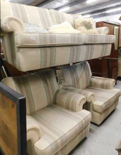 A three piece lounge suite, comprising three seater settee and two armchairs, in Regency style...