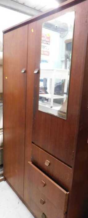 A 20thC Symbol Furniture teak compactum wardrobe.