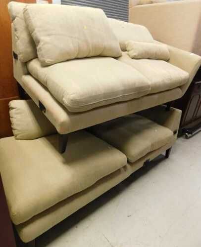 A two piece corner sofa, in two parts, with removable cushions, in striped cream material.