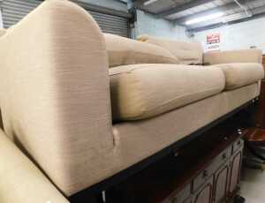 A large two seater lounge settee, in grey material.