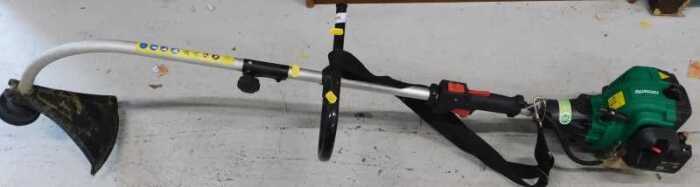 A Qualcast petrol strimmer.