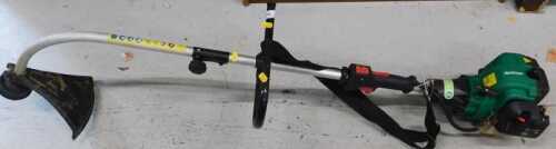 A Qualcast petrol strimmer.