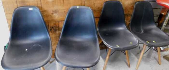 A set of four IKEA style black plastic chairs on turned lightwood legs, two high bar stools. (a...