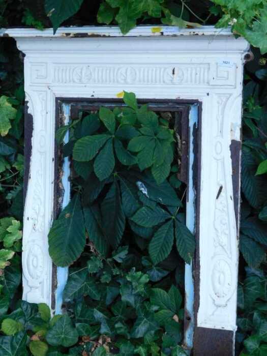 A 19thC cast iron fire surround, painted white.