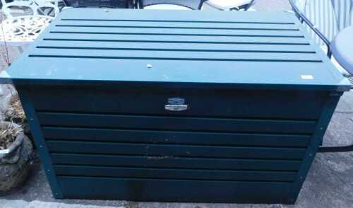 A Biohort outside metal storage unit, in green slatted metal.