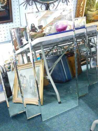 An Art Deco design stepped mirror, with bevelled glass, of rectangular form, 96cm x 99cm.