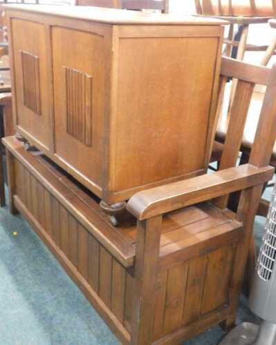 An oak linen fold blanket box, and a pine stained monk's bench, with log box seat.