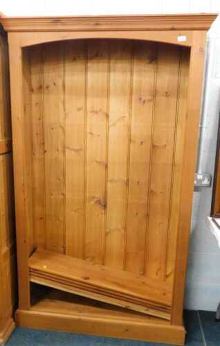A pine open bookcase, and two pine double door wardrobes.