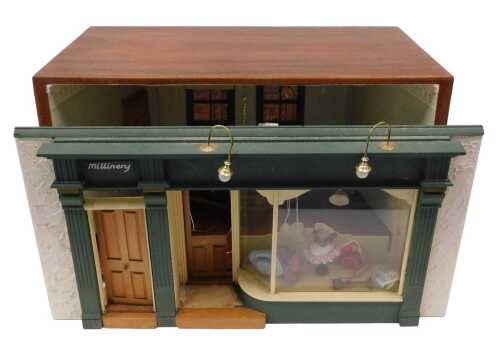 A 20thC diorama formed as a millinery shop front, of rectangular form with electric feature,...
