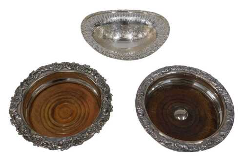 Various silver plated ware, a 20thC coaster, with scroll outline on oak base, 16cm wide, another...