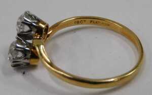 A two stone dress ring, set with two round brilliant cut imitation diamonds, in platinum claw... - 2