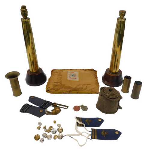 Various militaria, brass buttons, a Royal Air Force cushion, various shell cases, RAF shoulder...