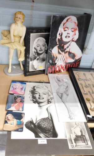 A collection of Marilyn Monroe memorabilia, to include pictures, coasters, 2003 calendar, and a...