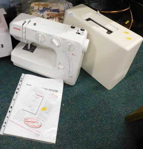 A Janome model J324 electric sewing machine, with instructions, together with a quantity of...