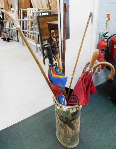 Various walking sticks, shepherd's crook, horn handled crook, umbrella, etc., in a part material...