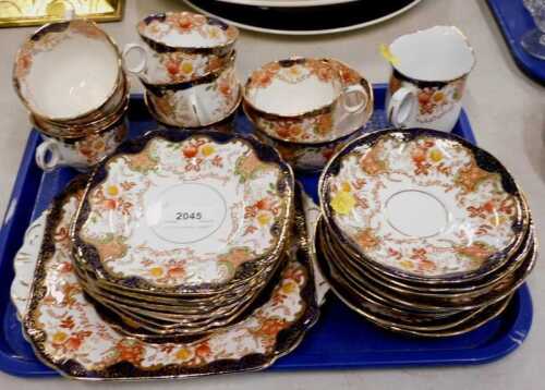 An early 20thC Crown bone china part tea service, part settings for six, to include cups,...