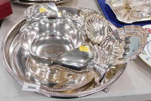 Various silver plated ware, a galleried edge circular tray, various butter dishes, gravy boat,...