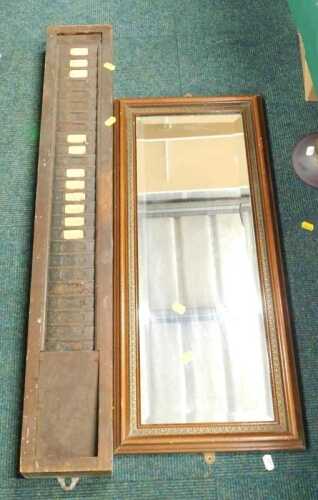 A vintage time card rack with metal front and a rectangular mirror. (2)