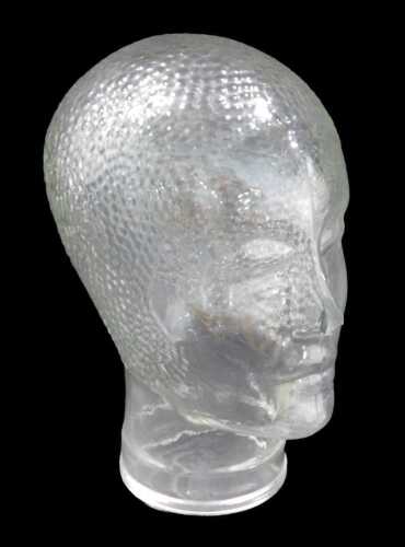 A pressed moulded glass head, with textured hair and damage to nose, 28cm high. (AF)