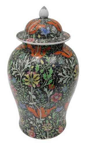 A Chinese porcelain jar and cover, the domed lid raised above an inverted shouldered circular...