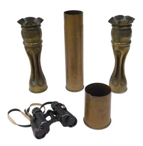 Trench Art. A pair of early WWI shell case vases, with flared rims and inverted stems, 34cm high,...