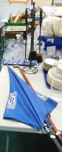 An iron fireside companion set, Rolls Royce umbrella, and a brass putter topped walking stick. (3)