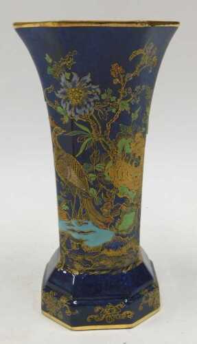 A Carltonware Bleu Royale chinoiserie vase, of octagonal form, decorated with exotic birds and...