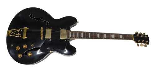 An Epiphone Sheraton-II Proelectric style six string guitar, in black with gilt trim, 100cm long.