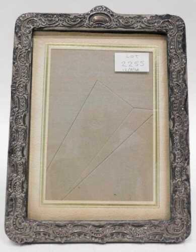 A silver mounted repousse photograph frame, 19cm x 25cm.