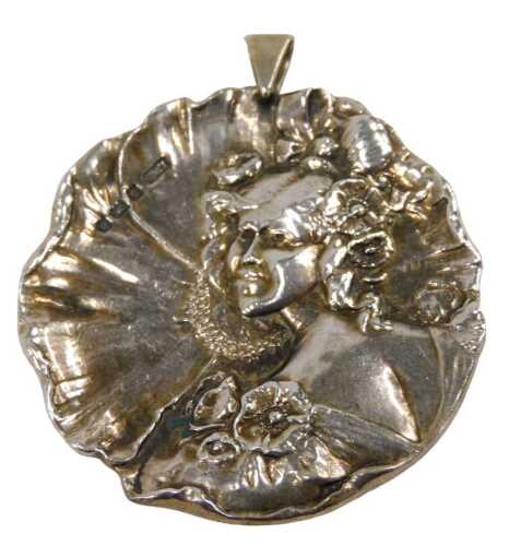 A Victorian silver pendant, moulded as a waterlily with embossed figure of female with flowing...