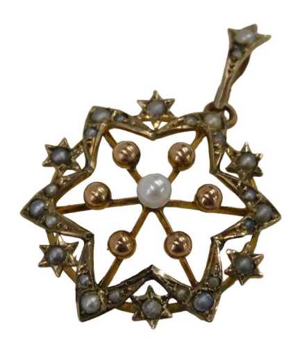 An Edwardian cultured pearl pendant, formed as a star, with rose gold and seed pearl points,...