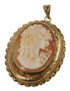 A late 20thC 9ct gold shell cameo locket, the central cameo depicting maiden looking dexter, in...