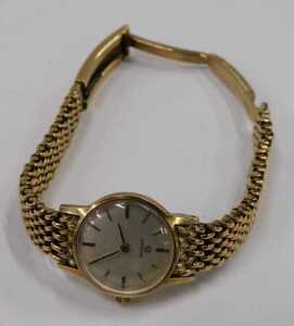 A 9ct gold Omega ladies wristwatch, with a silvered and baton watch face, on a full bar bracelet,... - 2