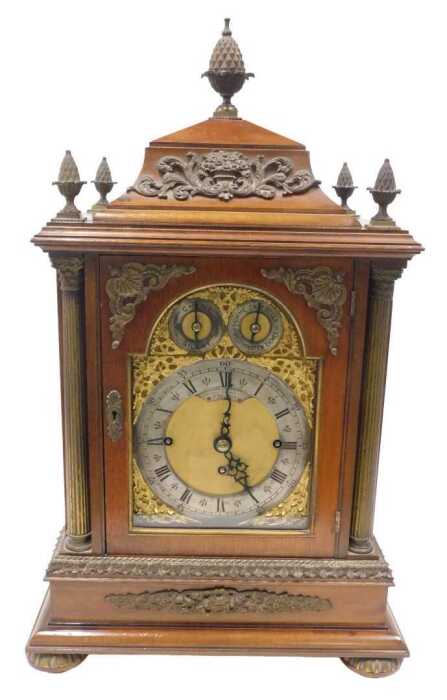 A 19thC mahogany chiming and musical bracket clock, in an elaborate case, with pineapple finial,...