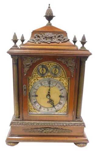 A 19thC mahogany chiming and musical bracket clock, in an elaborate case, with pineapple finial,...