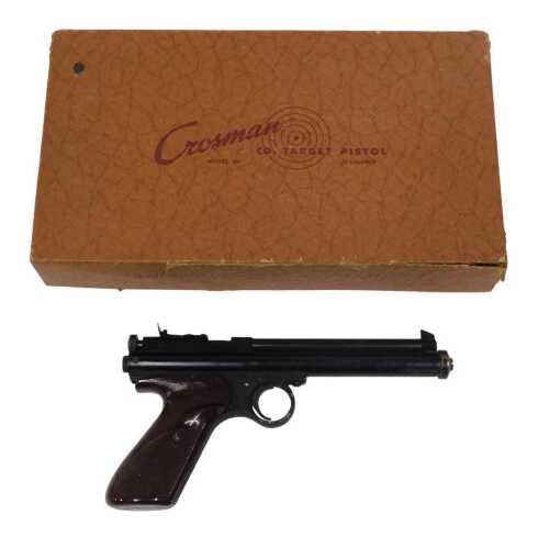 A Crosman model 116 .22 calibre air pistol, in original box, with targets, operating...