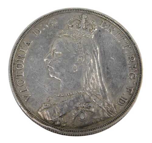 A Queen Victoria silver crown coin 1892, in outer capsule.