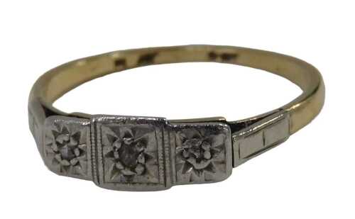 An Art Deco dress ring, the three sectional panel set with three tiny diamonds, on a yellow...