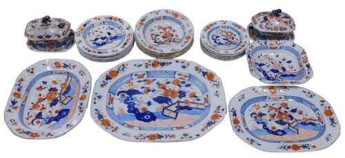 A 19thC Harlequin Imari pattern part dinner service, to include large meat plate, 50cm wide, a...