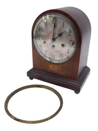 An Edwardian mahogany dome topped chiming mantel clock, the 20cm diameter silvered Arabic dial...