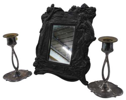 A Victorian style Art Nouveau design mirror, profusely decorated and raised with figures of...