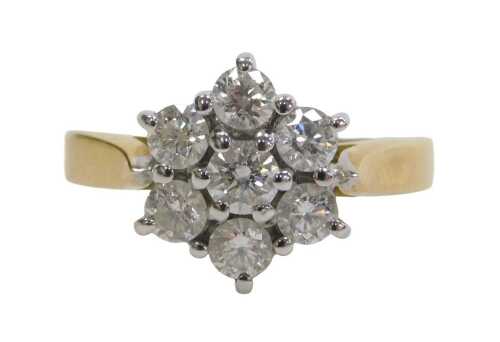 An 18ct gold diamond cluster ring, set with seven round brilliant cut diamonds, each...