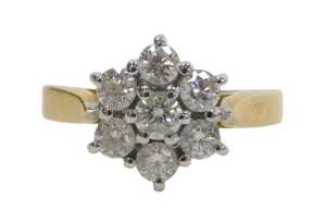 An 18ct gold diamond cluster ring, set with seven round brilliant cut diamonds, each...