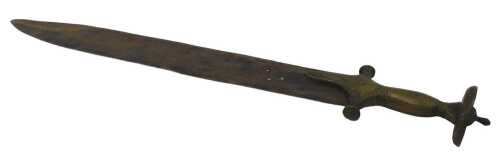 A 19thC Indian sword, with hammered and engraved brass handle, on a shaped blade, 57cm long.