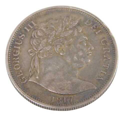 A George III silver half crown coin 1817, in outer capsule.