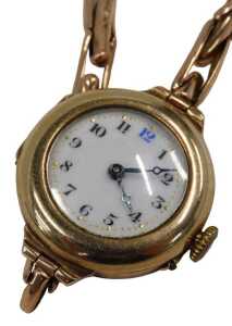 A mid-20thC wristwatch, the gold cased enamel watch head with a numbered border and blue hands,...