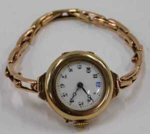 A mid-20thC wristwatch, the gold cased enamel watch head with a numbered border and blue hands,... - 2